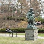 Campus Scenic Spring - Students work near statue