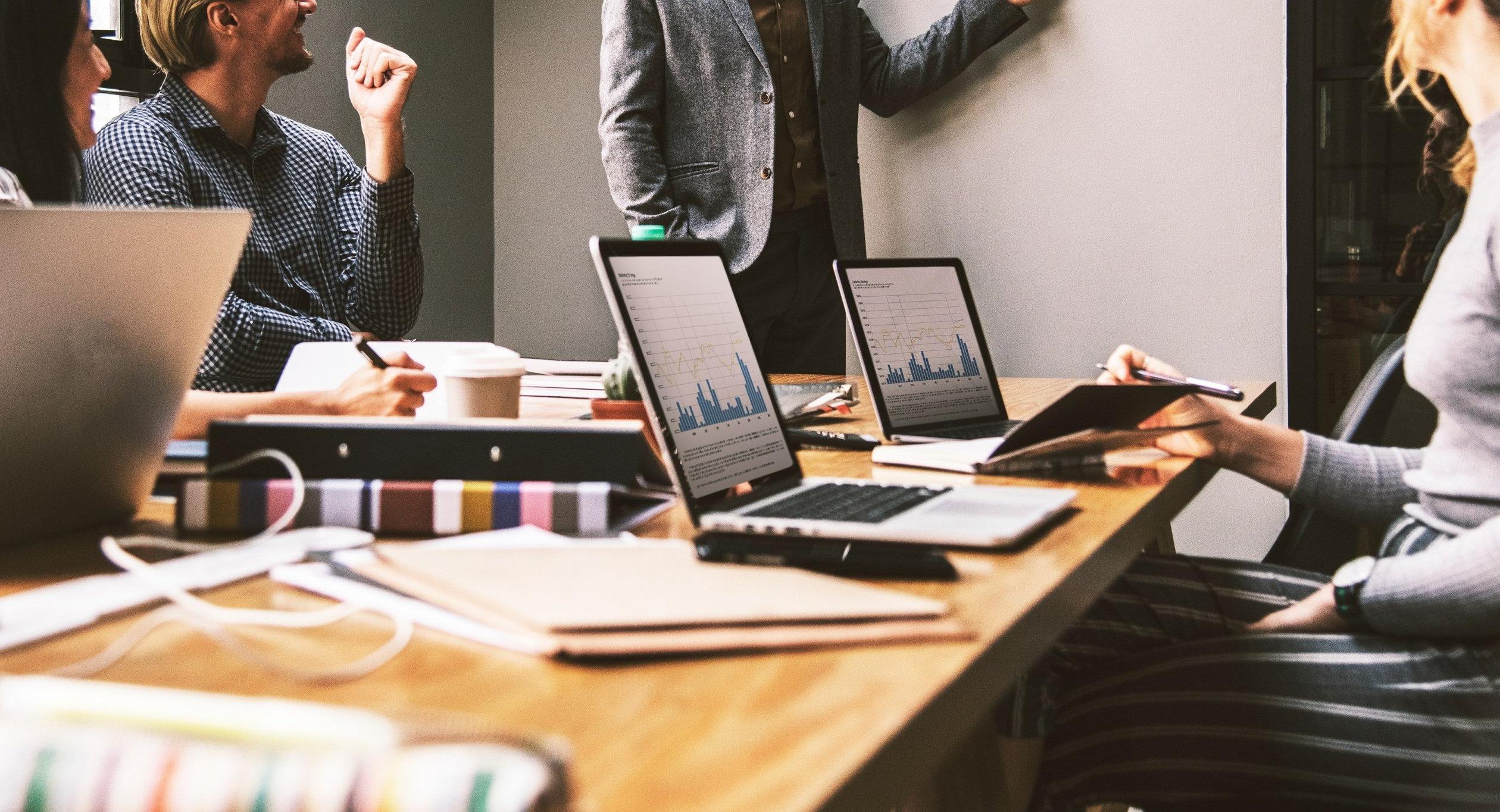 People in a board room holding a business meeting.